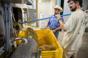 Grain is taken from First Magnitude Brewery and loaded into buckets for cattle feed at the UF IFAS Beef Teaching Unit.