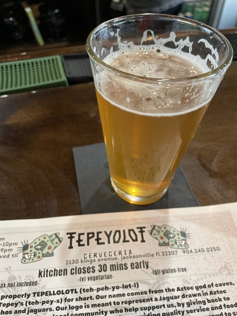 Pour of beer and a menu at Cerveceria Tepeyolot